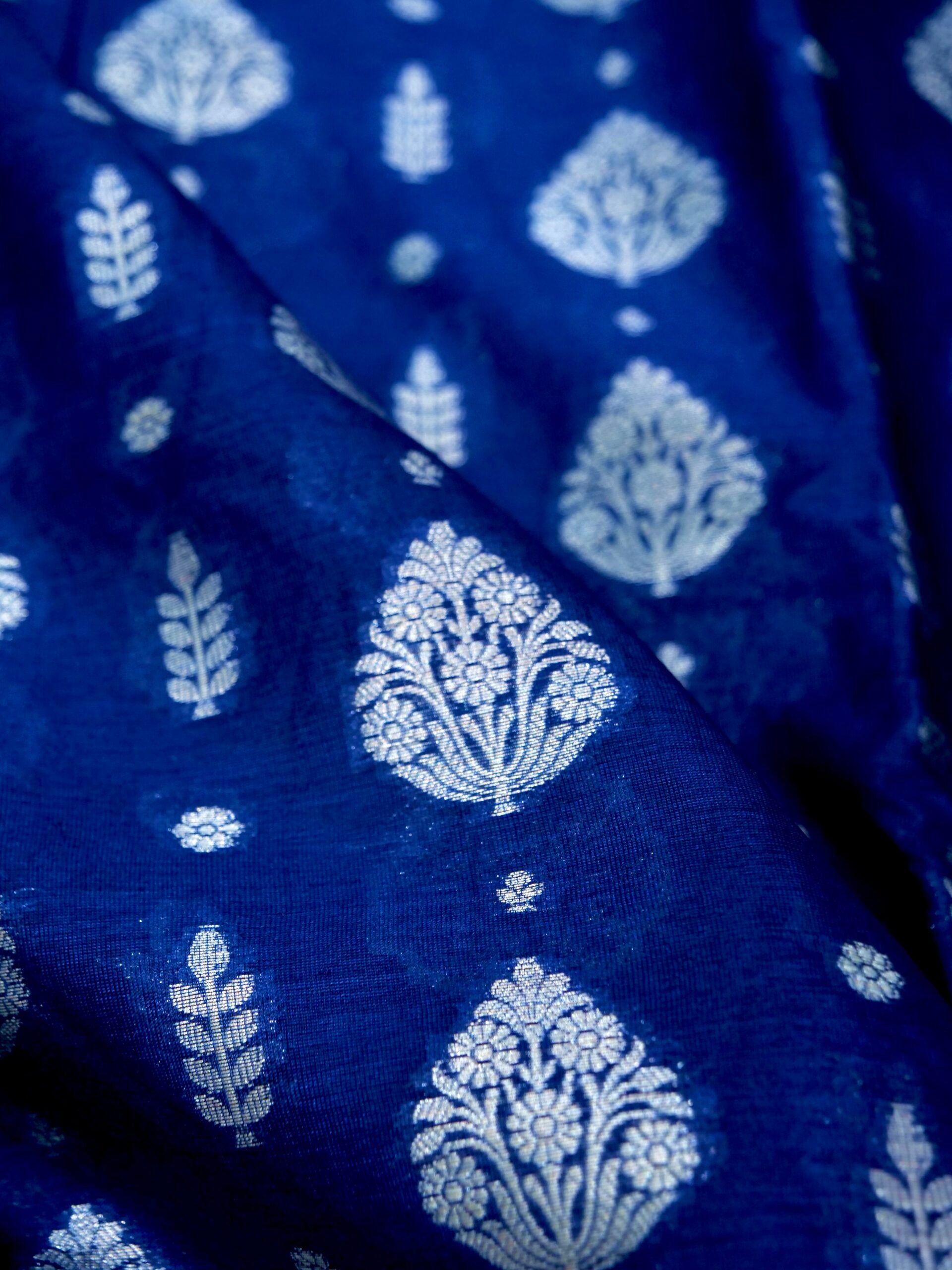 Navy Blue Warm Silk Saree With Big Silver Fancy Carry Buta